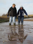 SX11261 Lib and Jenni paddling in icy puddle.jpg